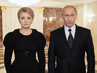 Юлия Тимошенко и Владимир Путин. Архивное фото с сайта premier.gov.ru